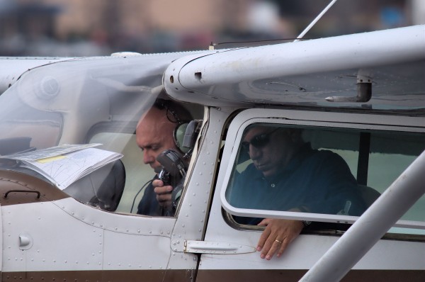 Pilot seated in a club airplane, representing the shared-ownership feel of flying club membership.
